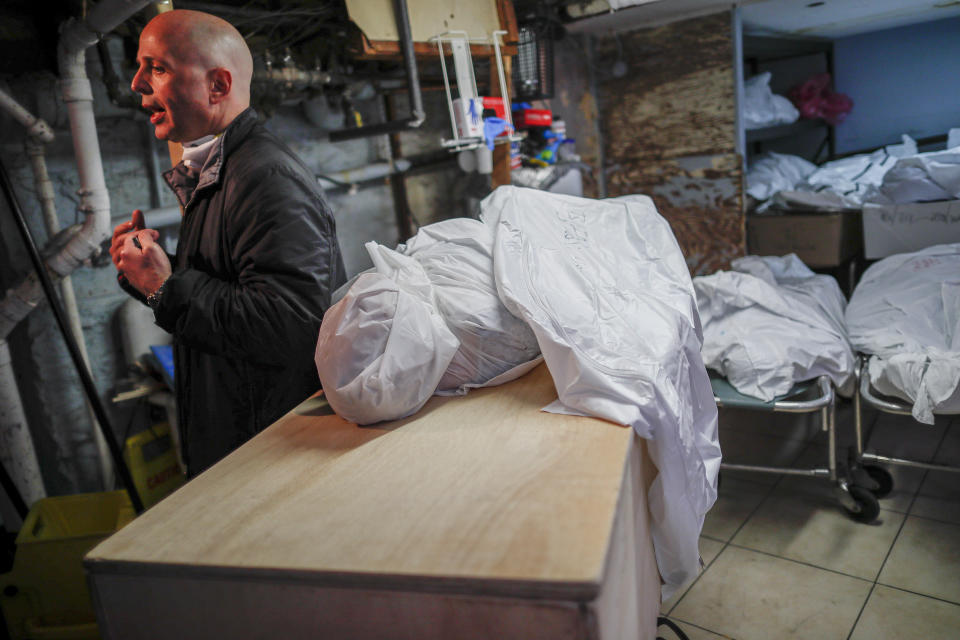 Pat Marmo, owner of Daniel J. Schaefer Funeral Home, is interviewed in his body holding facility, hoping for assistance in handling the overflow of clients stemming from COVID-19 deaths, Thursday, April 2, 2020, in the Brooklyn borough of New York. Like many funeral homes in New York and around the globe, Marmo's business is in crisis. "This is a state of emergency," he said. "We need help." (AP Photo/John Minchillo)