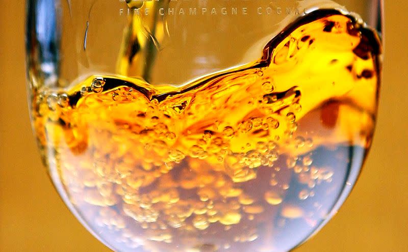 FILE PHOTO: Cognac is poured into a glass at Remy Martin distillery in Cognac