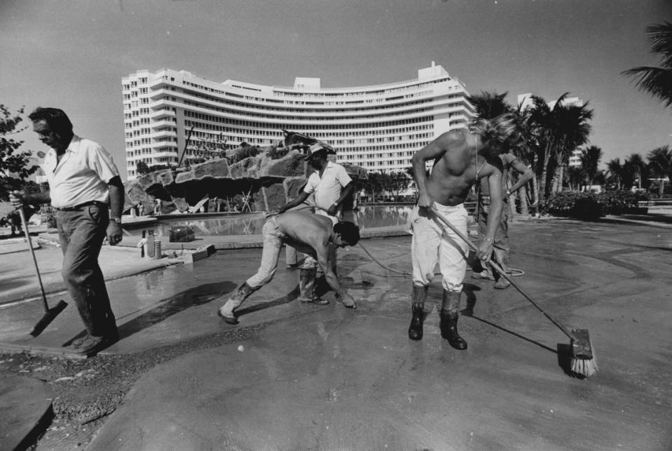 Workers at the hotel grounds.