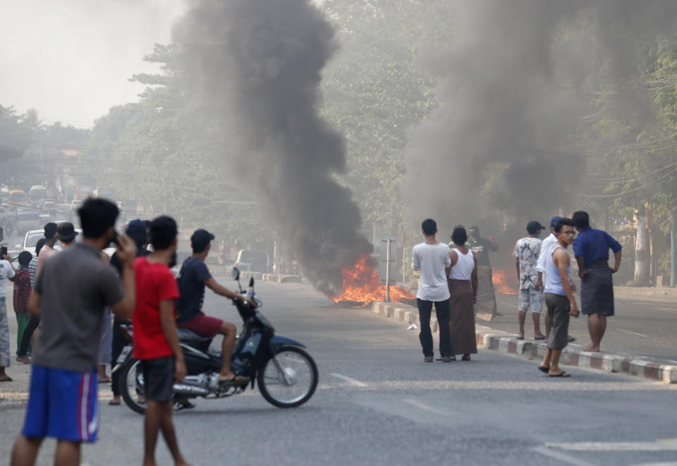 Protesters set fire on the road during the protest against the military coup in Myanmar. Source: AAP