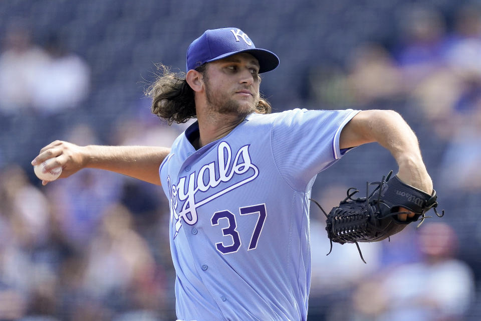 Kansas City Royals starting pitcher Jackson Kowar throws during the first inning of a baseball game against the Seattle Mariners Sunday, Sept. 19, 2021, in Kansas City, Mo. (AP Photo/Charlie Riedel)