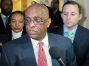 FILE - In a Tuesday, April 2, 2019 file photo, acting Baltimore Mayor Jack Young talks to reporters after meeting with state senators who represent Baltimore in Annapolis, M.D. Baltimore's mayor resigned under pressure Thursday, May 2, 2019 amid a flurry of investigations into whether she arranged bulk sales of her self-published children's books to disguise hundreds of thousands of dollars in kickbacks. Now that Pugh has resigned, acting Mayor Bernard "Jack" Young automatically becomes the permanent mayor and will not need to be sworn in. (AP Photo/Brian Witte, File)