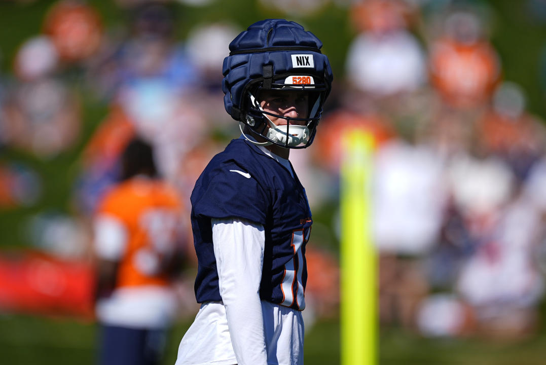 Denver Broncos rookie quarterback Bo Nix () takes part in drills during an NFL football training camp Monday, Aug. 5, 2024, at the team's headquarters in Centennial, Colo. (AP Photo/David Zalubowski)