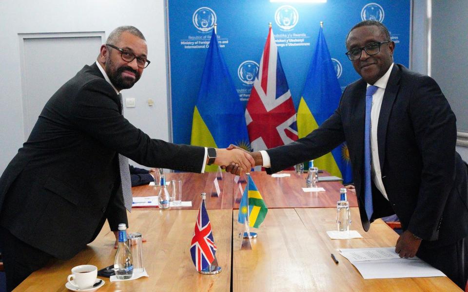 James Cleverly and Vincent Biruta after signing a cooperation treaty in Kigali, Rwanda