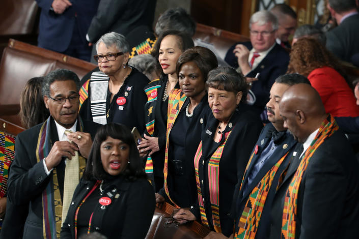 <p>Members of Congress wear black clothing and kente cloth in protest at the State of the Union address in the chamber of the U.S. House of Representatives on Jan. 30 in Washington, D.C. (Photo: Mark Wilson/Getty Images) </p>