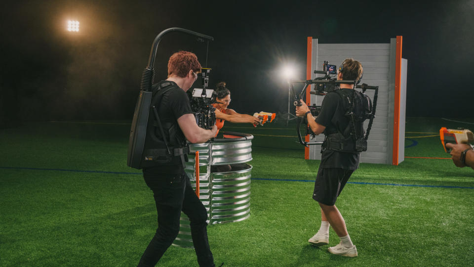 Two photographers film a Nerf commercial.