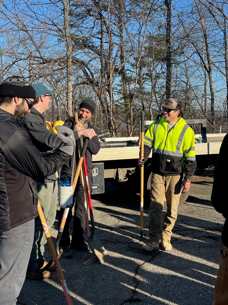 Volunteers discuss plans for the work day on Sharp's Ridge.