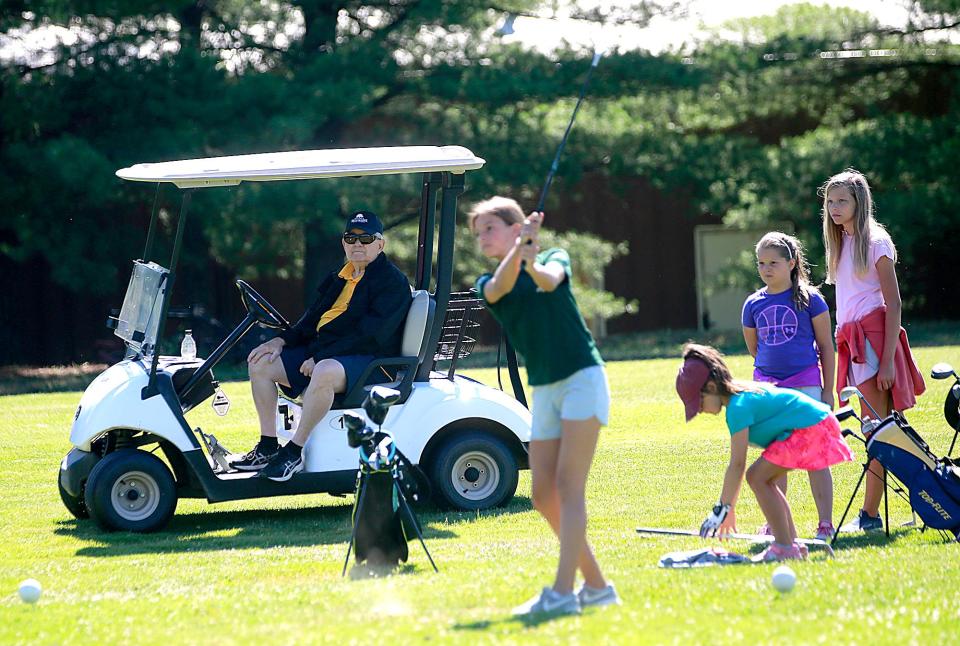 Instructor Paul Dienstberger watches some young female golfers play a hole on the range course at the Brookside Junior Golf program that is celebrating it's 50th year this year on Monday, June 27, 2022. TOM E. PUSKAR/ASHLAND TIMES-GAZETTE