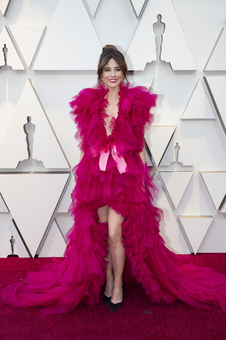 <p>The “Green Book” star vamped it up on the red carpet in a bright pink gown that was anything but subtle. But it wasn’t a hit with everyone. Some compared Cardellini to Elmo or Big Bird’s red-headed sister, and one even said the 43-year-old looked like she had raided someone’s craft cupboard for the ensemble. <em>[Photo: Getty]</em> </p>