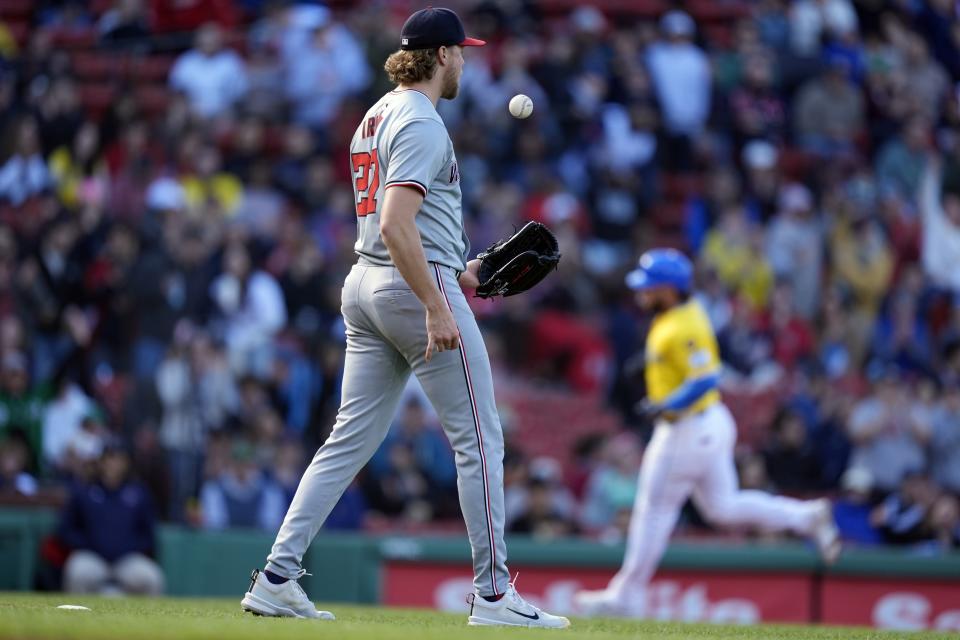 Washington Nationals pitcher Jake Irvin (27) walks off the mound after giving up a solo home run to Boston Red Sox's Wilyer Abreu, back right, during the third inning of a baseball game, Saturday, May 11, 2024, in Boston. (AP Photo/Michael Dwyer)