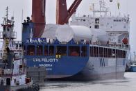 The ship UHL Felicity, carrying wind turbine tower sections, arrives Wednesday, May 24, 2023, to dock in New Bedford, Mass. Once assembled by developer Vineyard Wind, the turbines at sea will stand more than 850 feet high. (AP Photo/Josh Reynolds)