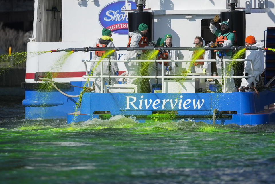 Members of the Chicago Journeymen Plumbers Local 130 dye the Chicago River green ahead of St. Patrick's Day celebrations, Saturday, March 16, 2024, in Chicago. (AP Photo/Erin Hooley)