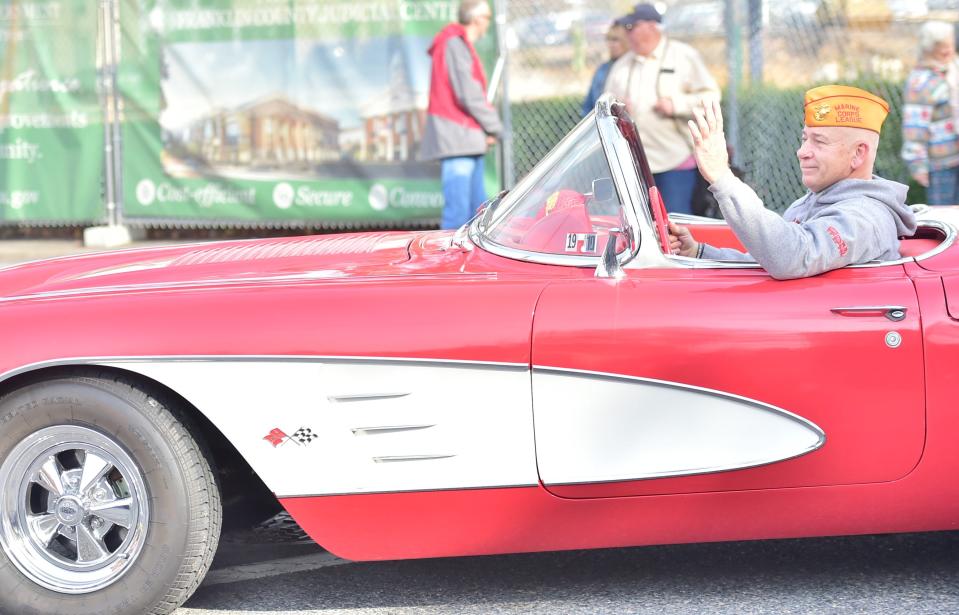 A local Marine drives a classic Corvette into Memorial Square during the Chambersburg Veterans Day parade in 2019.