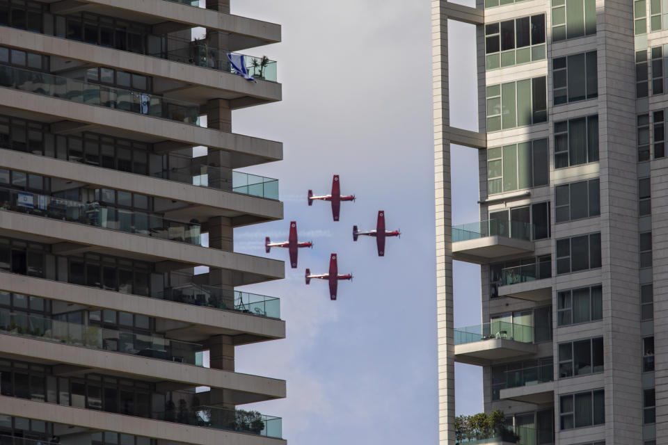 Israeli Air Force aerobatic team flies in formation during celebrations for Israel's 72nd Independence Day, in Tel Aviv, Israel, Wednesday, April 29, 2020. The Israeli government announced a complete lockdown over their 72nd Independence Day to control the country's coronavirus outbreak. (AP Photo/Oded Balilty)