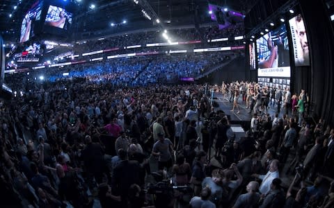 UFC lightweight champion Conor McGregor interacts with the crowd on stage during his official weigh-in at T-Mobile Arena on August 25, 2017 in Las Vegas, Nevada. Mayweather will meet boxer Floyd Mayweather Jr. in a super welterweight boxing match at T-Mobile Arena on August 26 - Credit:  Zuffa LLC