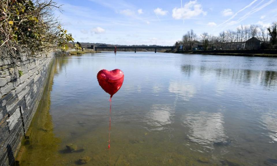 A red balloon in the river Teifi in Cardigan, Wales