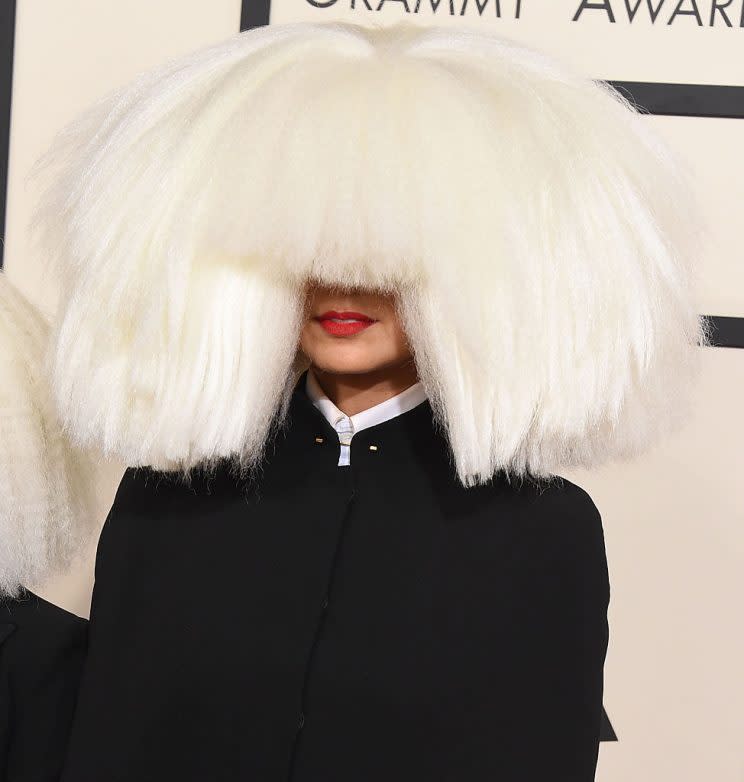 Sia arrived at the 57th Annual Grammy Awards with a huge platinum blond choppy wig in 2015. (Photo: Steve Granitz/WireImage)