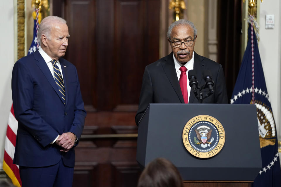 President Joe Biden listens as Rev. Wheeler Parker, Jr., speaks at an event to establish the Emmett Till and Mamie Till-Mobley National Monument, in the Indian Treaty Room in the Eisenhower Executive Office Building on the White House campus, Tuesday, July 25, 2023, in Washington. (AP Photo/Evan Vucci)