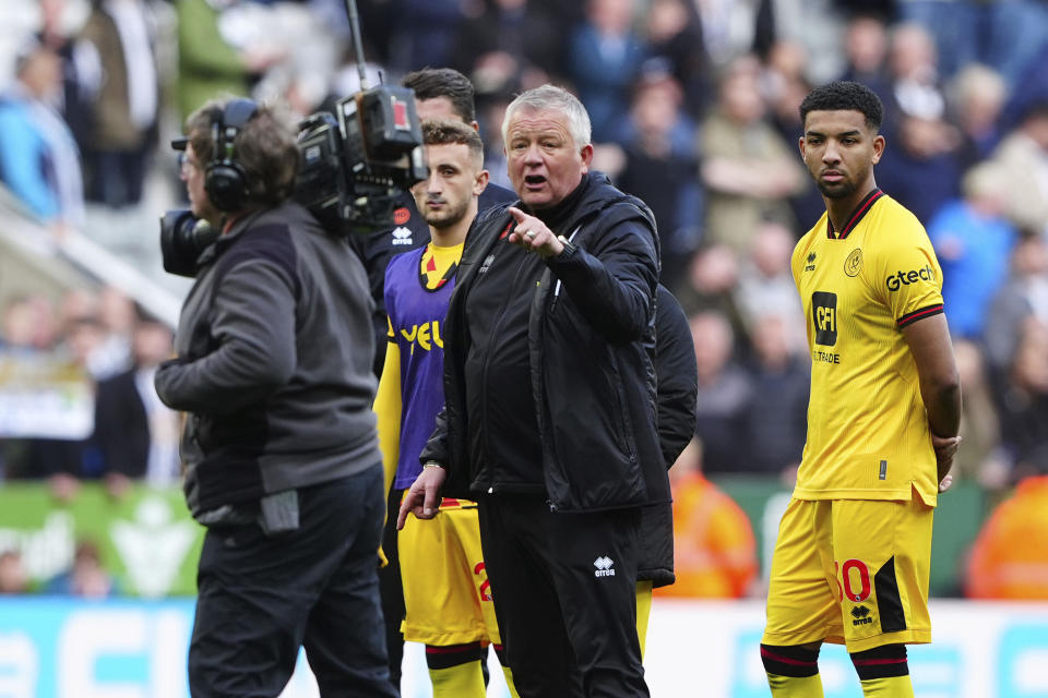 Sheffield United manager Chris Wilder, centre, reacts to the camera man after the English Premier League soccer match between Newcastle United and Sheffield United at St. James' Park, Newcastle, England, Saturday, April 27, 2024. (Owen Humphreys/PA via AP)