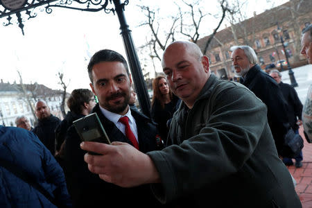 Chairman of the Hungarian right wing opposition party Jobbik Gabor Vona poses for a selfie after a campaign forum in Nagykanizsa, Hungary, March 16, 2018. Picture taken March 16, 2018. REUTERS/Bernadett Szabo
