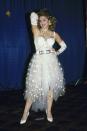 <p>For her first award show performance at the MTV VMA's, Madonna left a lasting impression with her white sheer "Like a Virgin" look. Complete with the now iconic "Boy Toy" belt, lace gloves, and cross necklaces, it kicked off her natch for creating buzzy looks. </p>