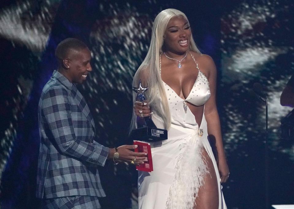 Lena Waithe, left, presents Megan Thee Stallion with the award for video of the year for "WAP".