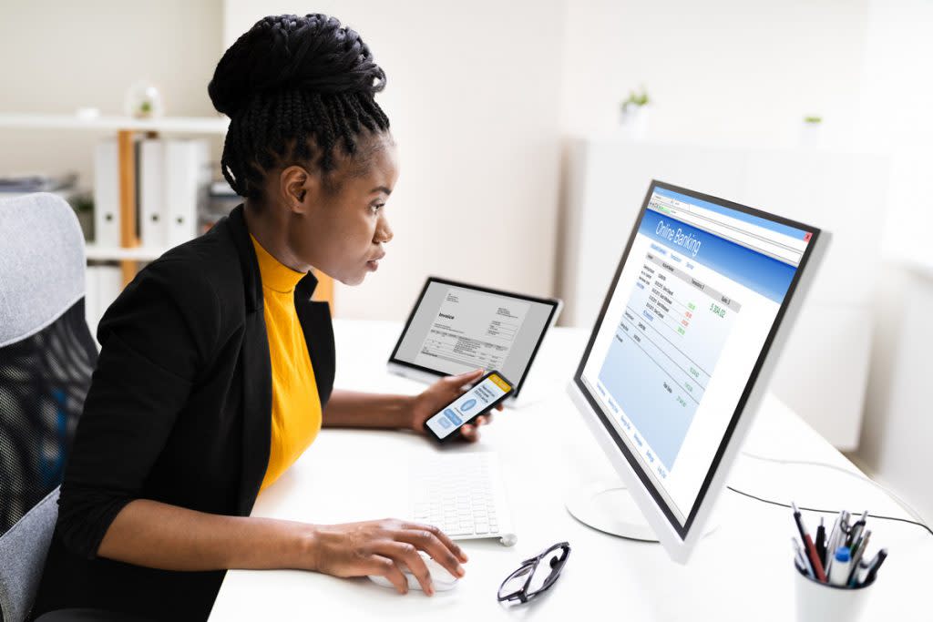 A woman uses a two-factor authentication to access her online banking.