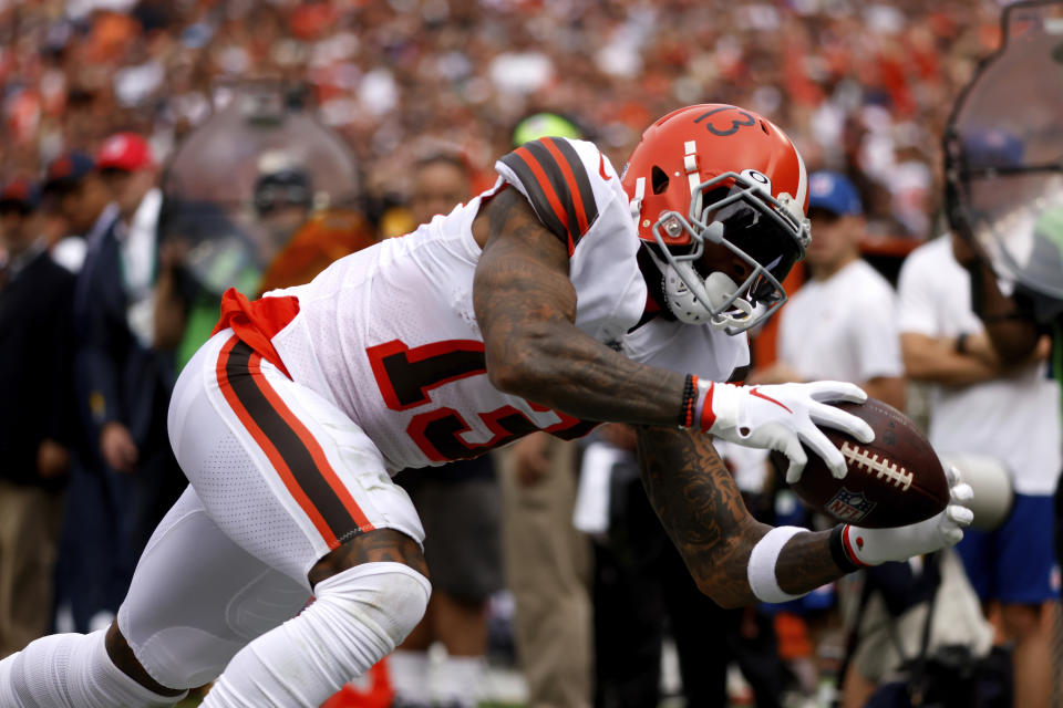 Cleveland Browns wide receiver Odell Beckham Jr. (13) dives in an attempt to make a catch during an NFL football game against the Chicago Bears, Sunday, Sept. 26, 2021, in Cleveland. (AP Photo/Kirk Irwin)