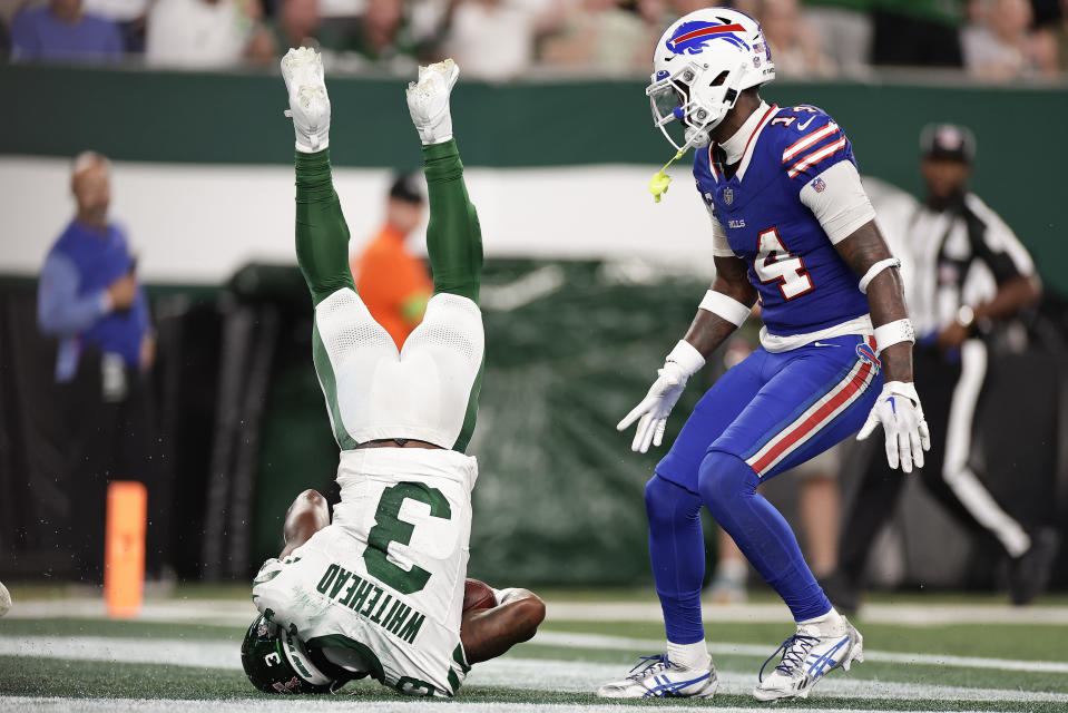 New York Jets safety Jordan Whitehead (3) intercepts a pass in the end zone against the Buffalo Bills wide receiver Stefon Diggs (14) during the third quarter of an NFL football game, Monday, Sept. 11, 2023, in East Rutherford, N.J. (AP Photo/Adam Hunger)