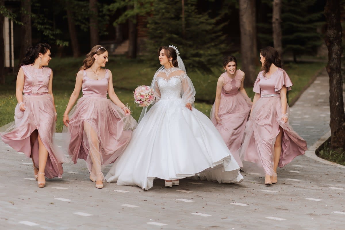 A bride with her bridesmaids. Much of the hard work that goes into planning a wedding comes long before the bride walks down the aisle (Getty Images)