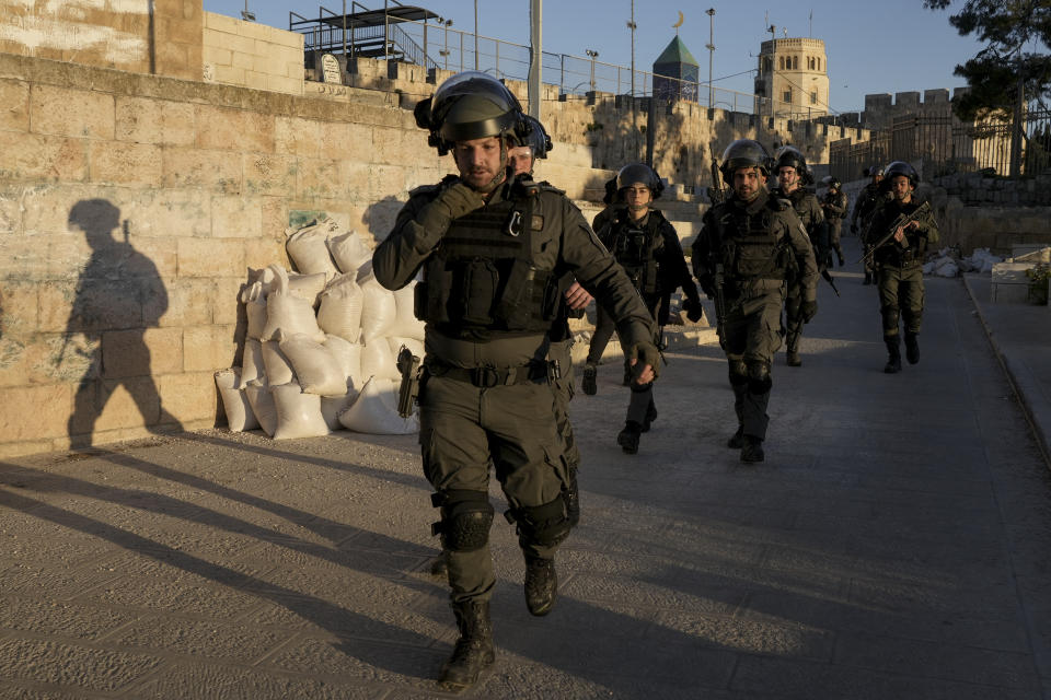 Israeli security forces gather during clashes with Palestinian demonstrators at the Al Aqsa Mosque compound in Jerusalem's Old City Friday, April 15, 2022. (AP Photo/Mahmoud Illean)