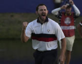 United States' Patrick Cantlay celebrates after holeing his putt on the 18th green to win the afternoon Fourballs match by 1 at the Ryder Cup golf tournament at the Marco Simone Golf Club in Guidonia Montecelio, Italy, Saturday, Sept. 30, 2023.