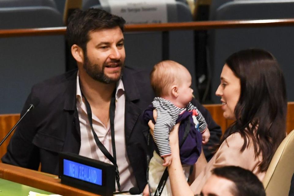 Jacinda Ardern (right) with her partner and their daughter | DON EMMERT/AFP/Getty