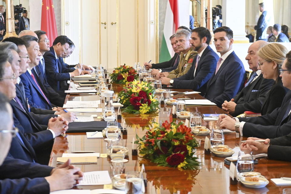 Hungarian President Tamas Sulyok, third right, and Chinese President Xi Jinping, fifth left, during their meeting in the presidential Alexander Palace in Budapest, Thursday, May 9, 2024. (Noemi Bruzak /MTI via AP)