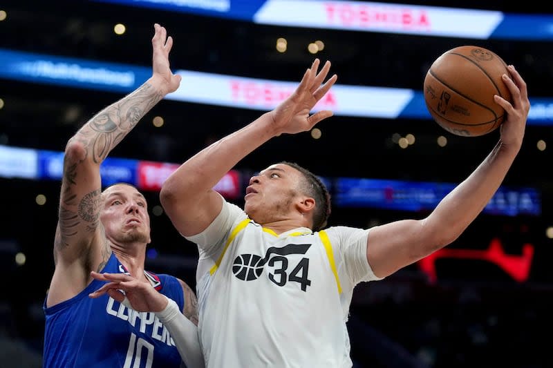 Utah Jazz forward Kenneth Lofton Jr. (34) goes to the basket against Los Angeles Clippers center Daniel Theis (10) during game in Los Angeles, Friday, April 12, 2024. AP Photo, Eric Thayer | Eric Thayer