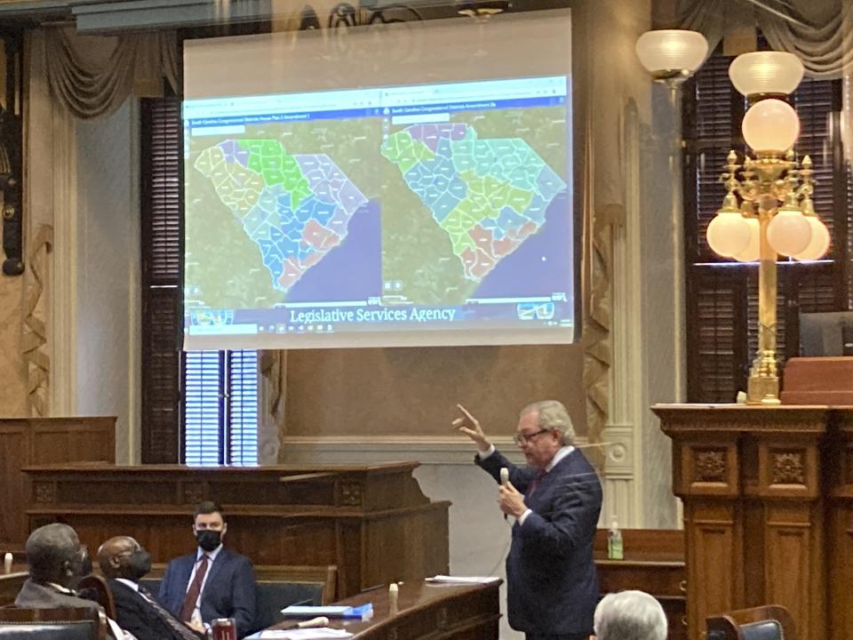 FILE - State Sen. Dick Harpootlian, D-Columbia, compares his proposed map of U.S. House districts drawn with 2020 U.S. Census data to a plan supported by Republicans on Jan. 20, 2022, in Columbia, S.C. Federal judges are deciding whether South Carolina's new congressional maps are legal in a lawsuit by the NAACP which says the districts dilute Black voting power. (AP Photo/Jeffrey Collins)