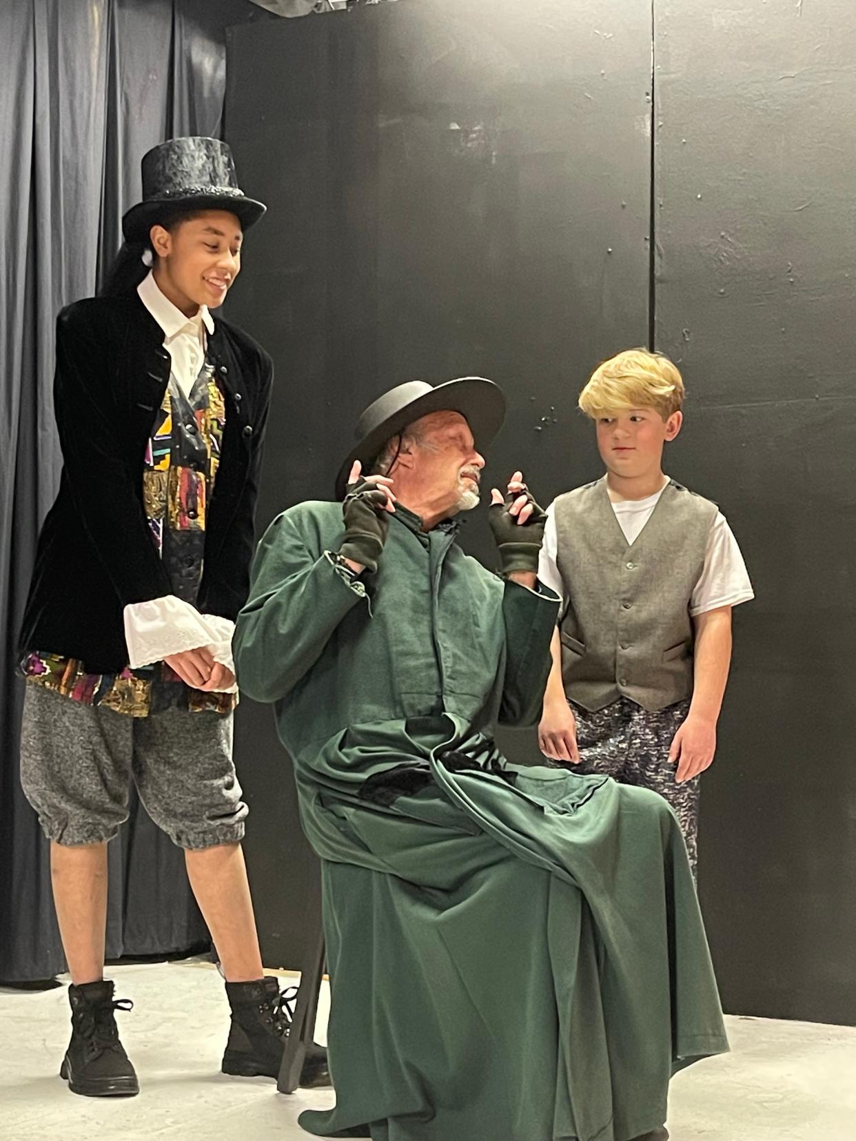 Erika Frye, left, as The Artful Dodger, Robert Richter, as Fagin, and Eli Gowan, as Oliver, rehearse a scene for Footlight Players' production of "Oliver!" that opens March 3 and continues through March 19, 2023, at the theater in Michigan City.