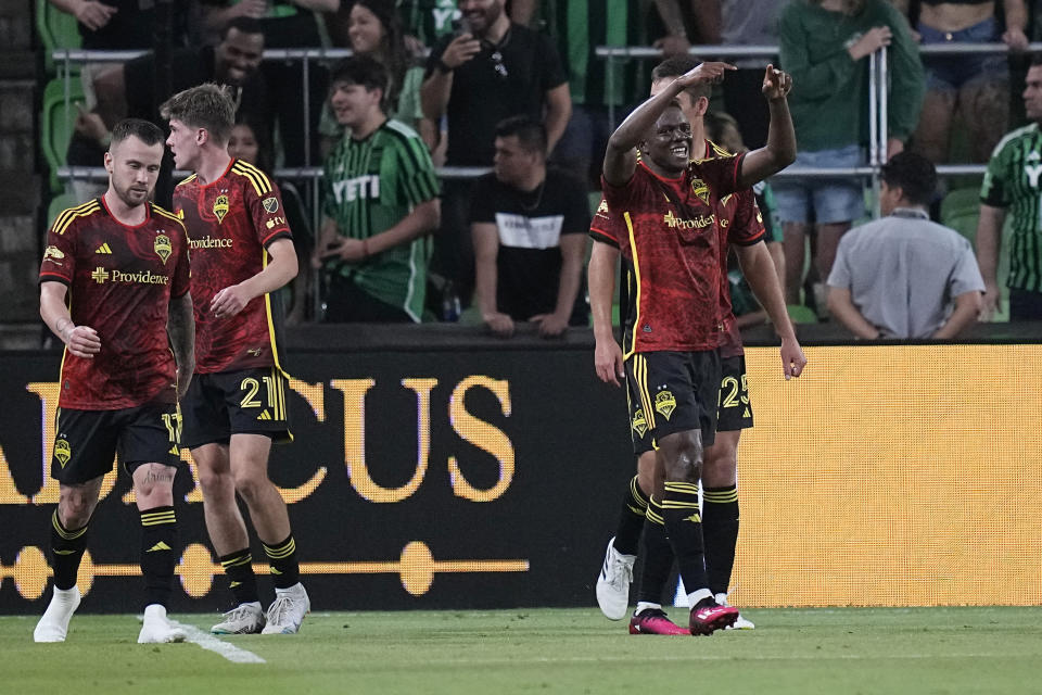 Seattle Sounders FC defender Nouhou Tolo, right, celebrates with teammates after his goal against Austin FC during the second half of an MLS soccer match in Austin, Texas, Wednesday, Aug. 30, 2023. (AP Photo/Eric Gay)