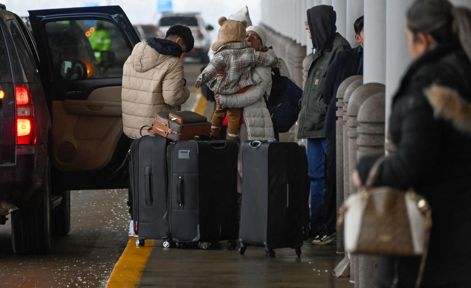 Passengers arrive for their flight on Southwest Airlines as flight cancellations mount during a cold weather front as a weather phenomenon known as a bomb cyclone hits the Upper Midwest, at Midway International Airport in Chicago, Illinois, U.S., December 22, 2022. REUTERS/Matt Marton