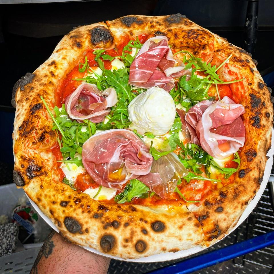 The Rossano pie at Rossanos Pizza in Delray Beach is topped with San Marzano tomatoes, fresh mozzarella, basil, arugula, prosciutto di Parma and burrata.