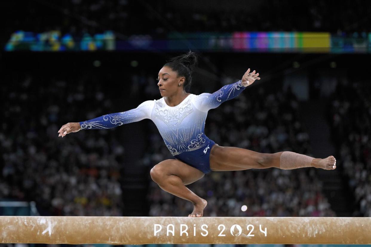 Simone Biles competes during the balance beam final on Monday.