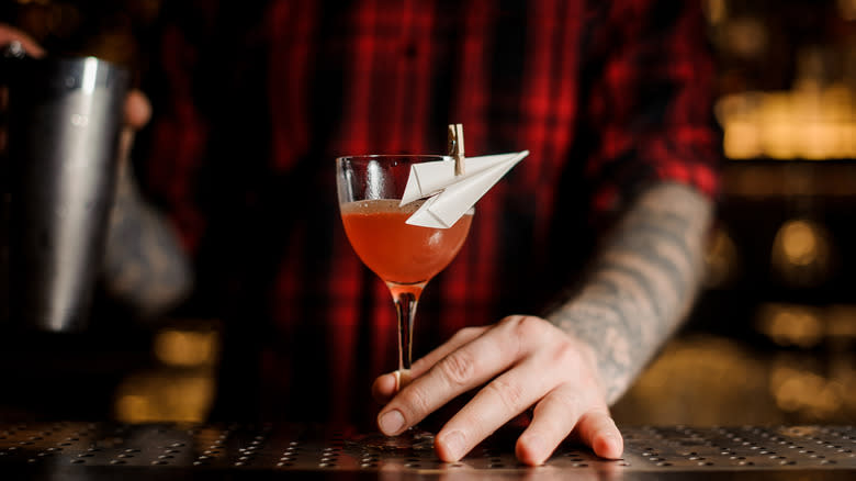 Bartender making a paper plane