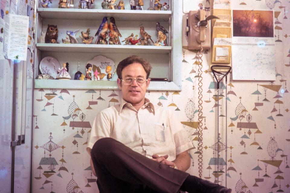 A younger Spencer Meckstroth poses for a picture at home, which was already overflowing with figurines and other tchotchkes.