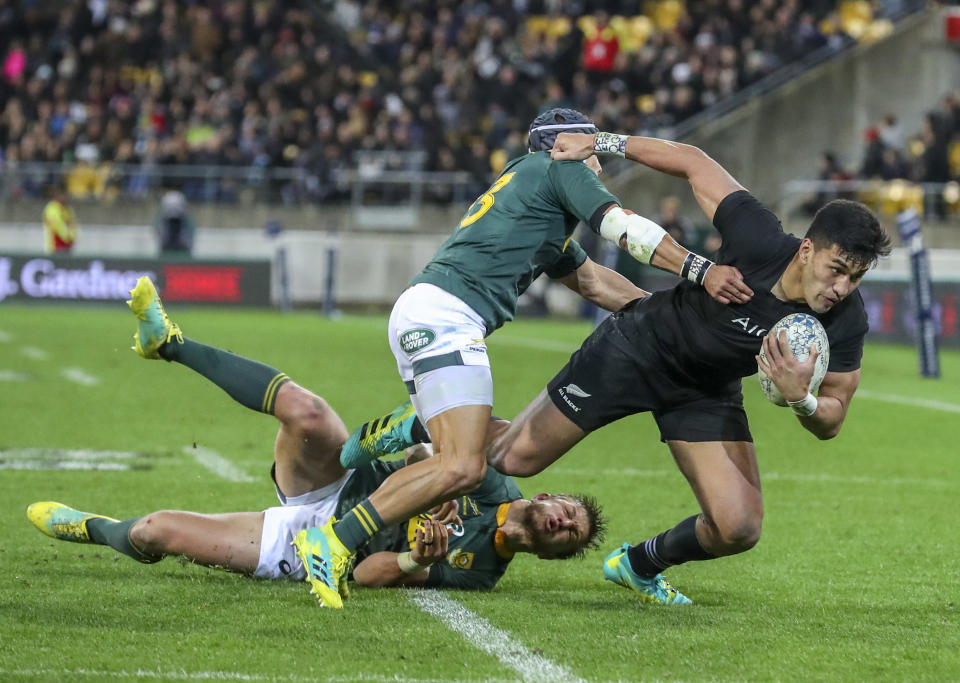 New Zealand's Rieko Ioane steps through a tackle during a rugby championship test match between South Africa and New Zealand in Wellington, New Zealand, Saturday, Sept. 15, 2018. (AP Photo/John Cowpland)