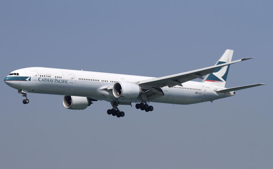 Chek Lap Kok, Hong Kong - January 27, 2017: This photo is of a Cathay Pacific Boeing 777 on final approach into Hong Kong International Airport, Hong Kong is one of Asia's largest International HUBS, it is currently basing 5 large airlines, Cathay Pacific, Cathay Dragon, Hong Kong Airlines, Hkexpress and Air Hong Kong. Cathay Pacific is one of the largest airlines in the world which is based at Hong Kong International Airport.