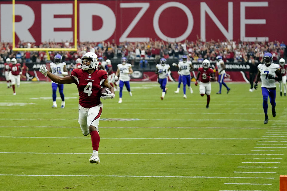 Arizona Cardinals wide receiver Rondale Moore (4) runs in for touchdown against the Minnesota Vikings during the first half of an NFL football game, Sunday, Sept. 19, 2021, in Glendale, Ariz. (AP Photo/Ross D. Franklin)