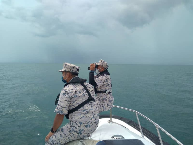 MMEA officers search for the missing divers during the search and rescue operation off the Mersing coast