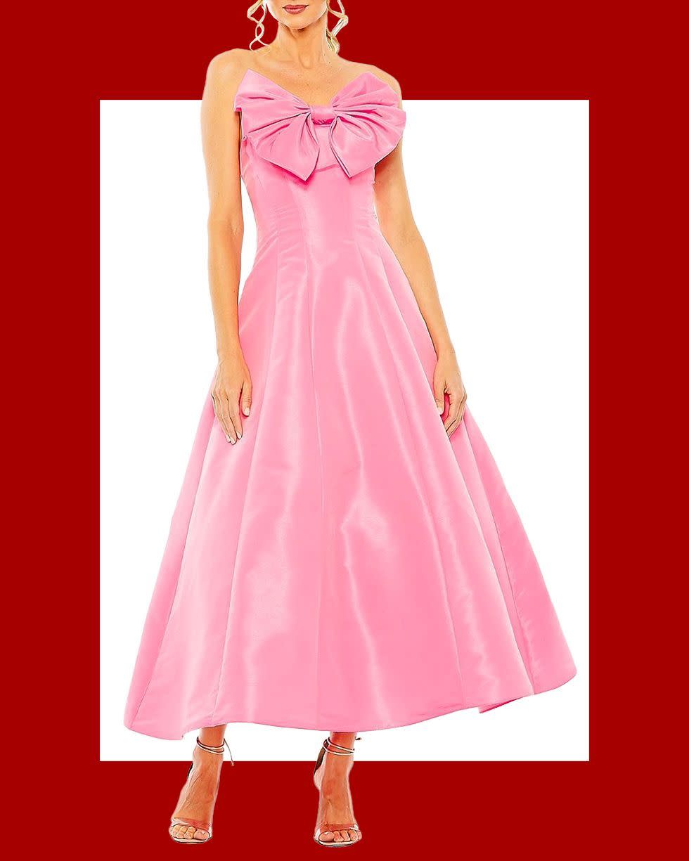 <p><a href="https://go.redirectingat.com?id=74968X1596630&url=https%3A%2F%2Fwww.saksfifthavenue.com%2Fproduct%2FMac-Duggal-Cocktail-Bow-Strapless-Ballgown-0400017760822.html&sref=https%3A%2F%2F" rel="nofollow noopener" target="_blank" data-ylk="slk:Shop Now;elm:context_link;itc:0;sec:content-canvas" class="link rapid-noclick-resp">Shop Now</a></p><p>Cocktail Bow Strapless Ballgown</p><p>$398.00</p><p>saksfifthavenue.com</p>