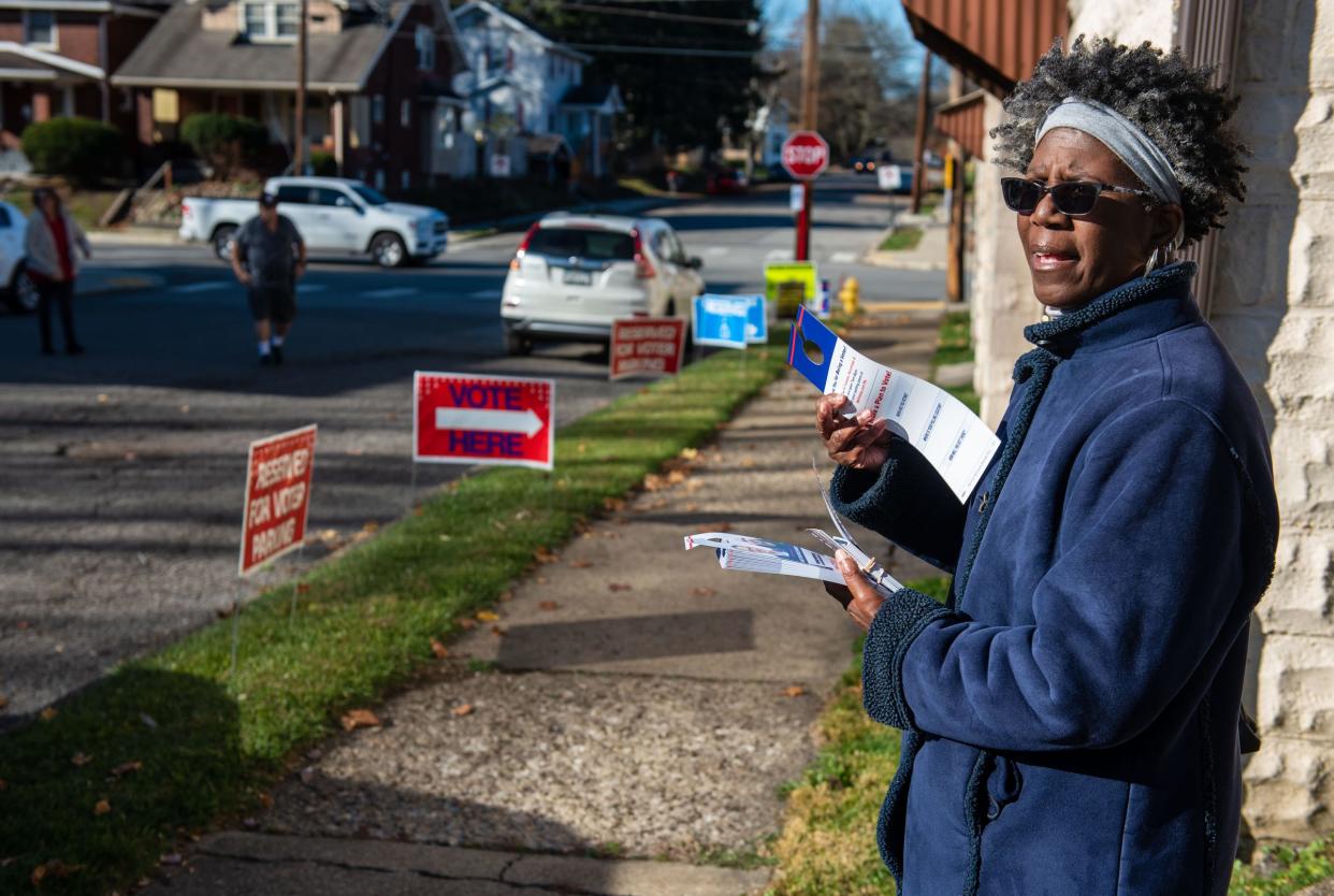 Volunteer Leanne Spearman, of Beaver Falls, stands outside of the polling place for Ward 5 District 6 in Beaver Falls Tuesday morning, waiting to pass out informational pamphlets.