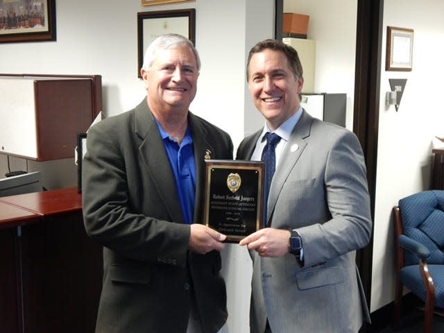 Palm Beach County State Attorney Dave Aronberg (right) and Assistant State Attorney Robert Jaegers are seen in this photo marking Jaegers' retirement after 31 years as a prosecutor. Jaegers was found dead on March 26, 2024 after being reported missing the previous day.